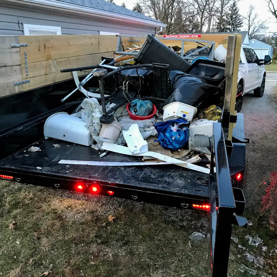 Roll-off dumpster delivered to a residential driveway in Grand Haven